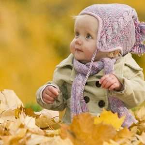 baby in autumn leaves